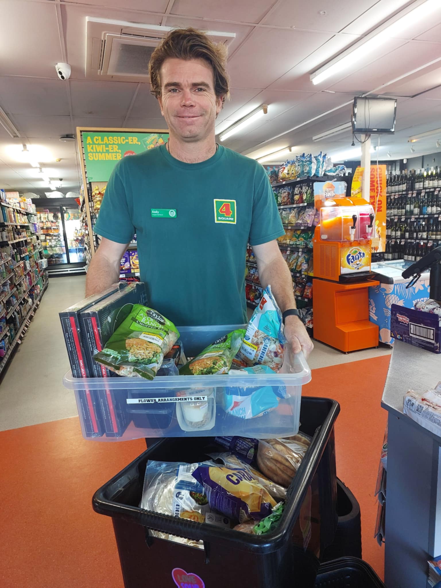 A local Four Square team member donating food to Love Soup